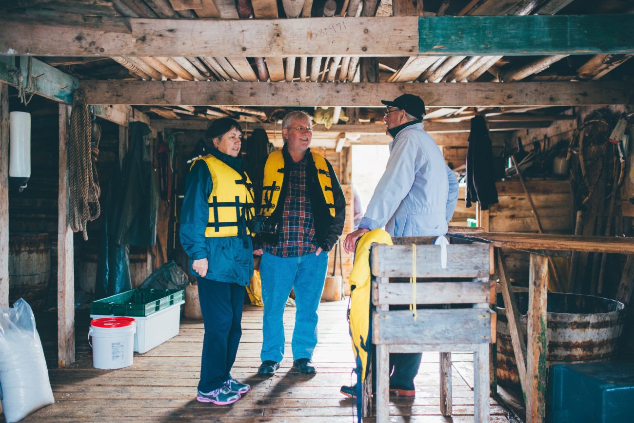 Rugged Beauty Boat Tour, Newfoundland 2 of Rugged Beauty's Passengers speak with a local fisherman