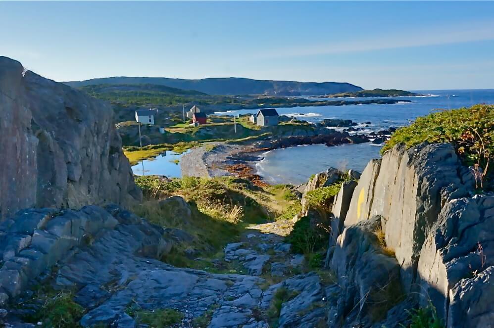 Rocky Terrain with houses and ocean