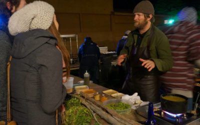 Chef Jeremy Charles explains his dish to a festival goer
